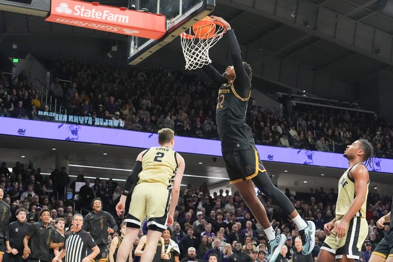 Mar 4, 2026; Evanston, Illinois, USA; Northwestern Wildcats forward Arrinten Page (22) dunks the ball on Purdue Boilermakers guard Fletcher Loyer (2) during the second half at Welsh-Ryan Arena. Mandatory Credit: David Banks-Imagn Images Mar 4, 2026; Evanston, Illinois, USA; Northwestern Wildcats forward Arrinten Page (22) dunks the ball on Purdue Boilermakers guard Fletcher Loyer (2) during the second half at Welsh-Ryan Arena. Mandatory Credit: David Banks-Imagn Images