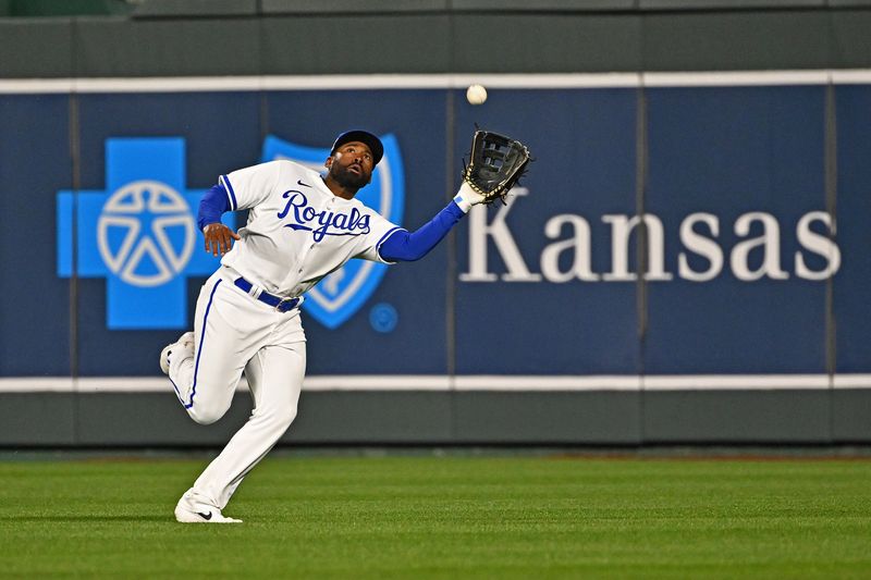 Apr 15, 2023; Kansas City, Missouri, USA;  Kansas City Royals center fielder Jackie Bradley Jr. (41) makes a running catch during the eighth inning against the Atlanta Braves at Kauffman Stadium. Mandatory Credit: Peter Aiken-USA TODAY Sports