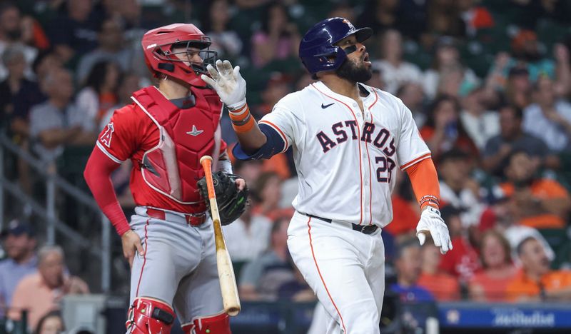 May 21, 2024; Houston, Texas, USA; Houston Astros first baseman Jon Singleton (28) hits a two-run home run during the sixth inning against the Los Angeles Angels at Minute Maid Park. Mandatory Credit: Troy Taormina-USA TODAY Sports