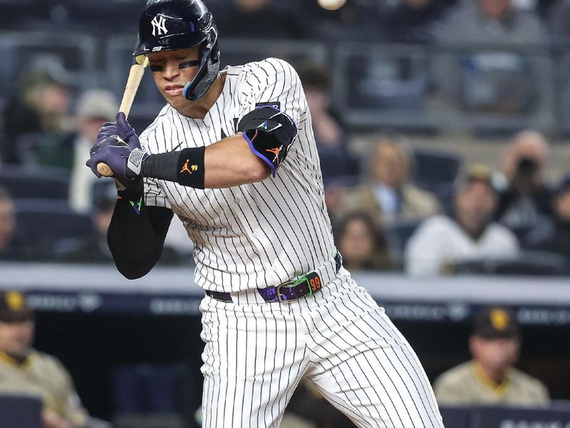 May 6, 2025; Bronx, New York, USA;  New York Yankees right fielder Aaron Judge (99) reacts after almost getting hit by a pitch in the fourth inning against the San Diego Padres at Yankee Stadium. Mandatory Credit: Wendell Cruz-Imagn Images