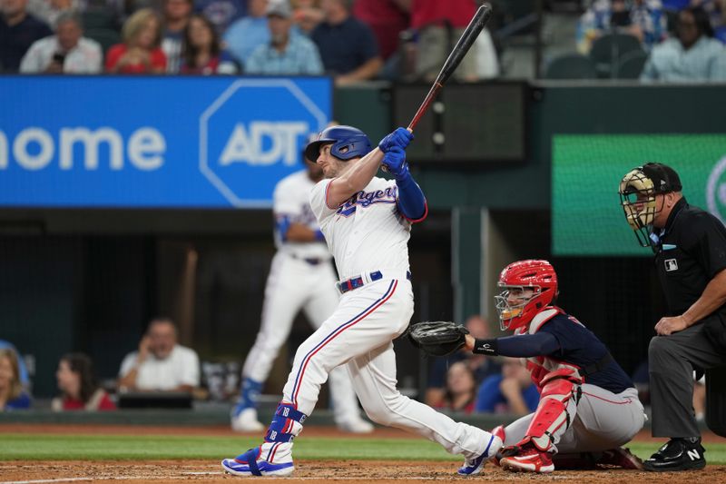 Sep 20, 2023; Arlington, Texas, USA; Texas Rangers designated hitter Mitch Garver (18) follows through on his home run against the Boston Red Sox during the second inning at Globe Life Field. Mandatory Credit: Jim Cowsert-USA TODAY Sports