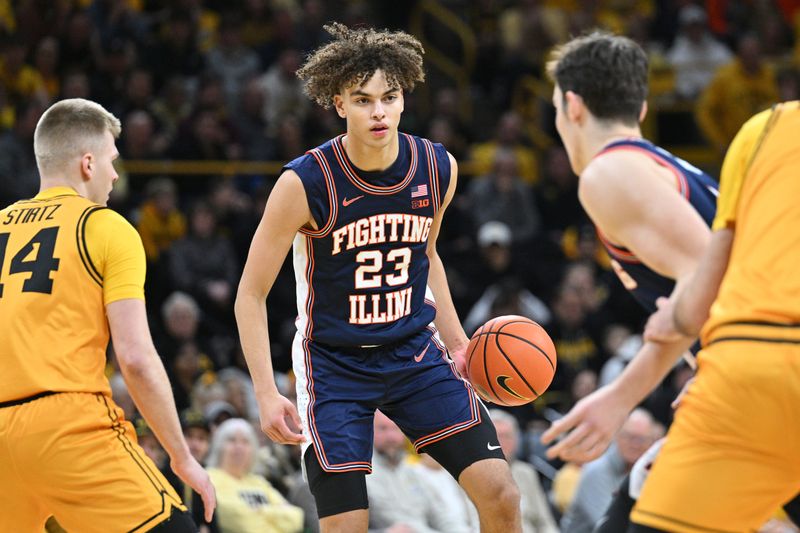 Jan 11, 2026; Iowa City, Iowa, USA; Illinois Fighting Illini guard Keaton Wagler (23) controls the ball against the Iowa Hawkeyes during the first half at Carver-Hawkeye Arena. Mandatory Credit: Jeffrey Becker-Imagn Images