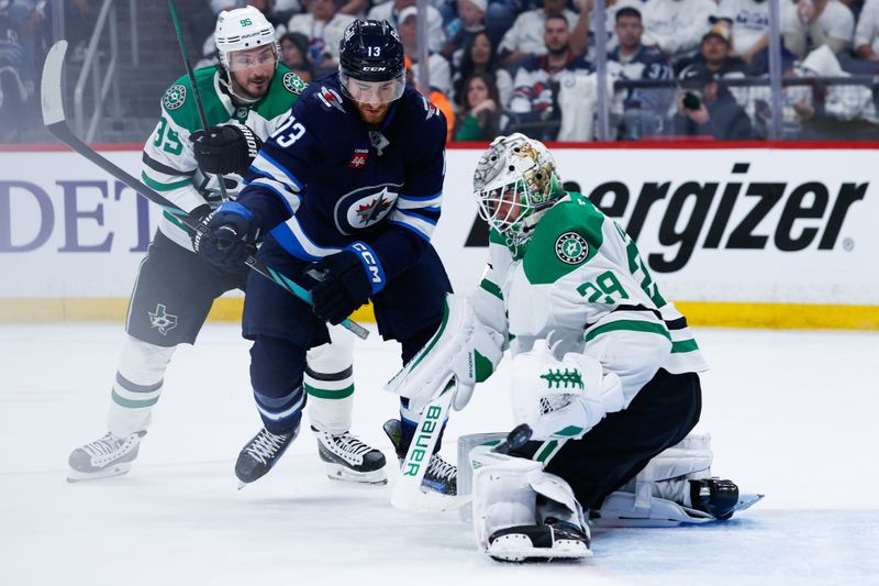 May 15, 2025; Winnipeg, Manitoba, CAN; Dallas Stars goalie Jake Oettinger (29) makes a save as Winnipeg Jets forward Gabriel Vilardi (13) looks for a rebound during the second period in game five of the second round of the 2025 Stanley Cup Playoffs at Canada Life Centre. Mandatory Credit: Terrence Lee-Imagn Images