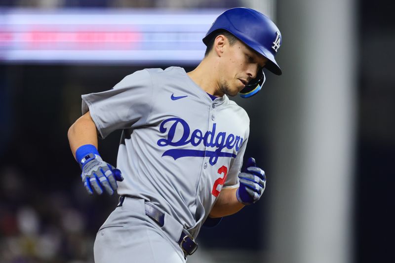 Sep 18, 2024; Miami, Florida, USA; Los Angeles Dodgers shortstop Tommy Edman (25) circles the bases after hitting a two-run home run against the Miami Marlins during the fourth inning at loanDepot Park. Mandatory Credit: Sam Navarro-Imagn Images