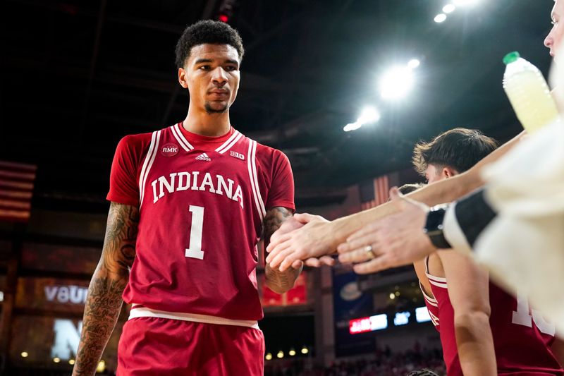 Jan 3, 2024; Lincoln, Nebraska, USA; Indiana Hoosiers center Kel'el Ware (1) high fives teammates on the bench against the Nebraska Cornhuskers during the second half at Pinnacle Bank Arena. Mandatory Credit: Dylan Widger-USA TODAY Sports