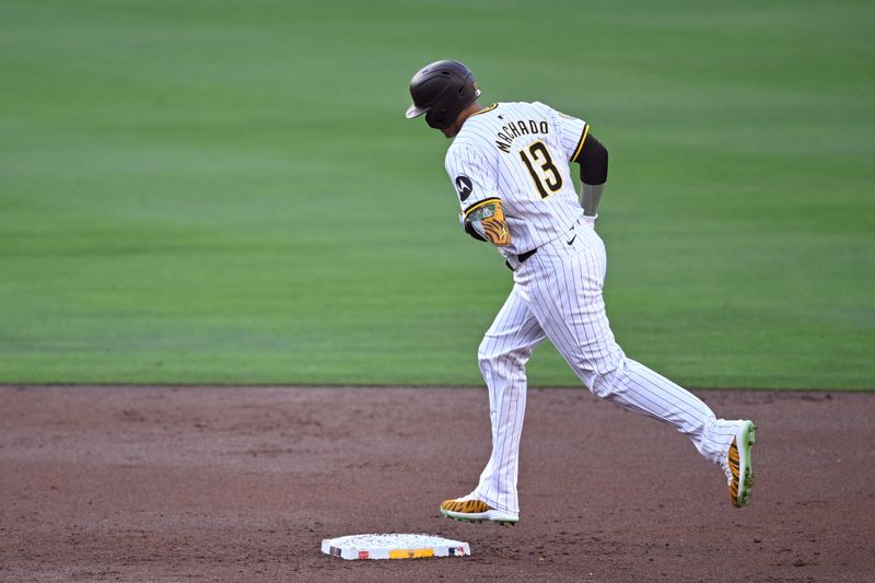 Jun 20, 2024; San Diego, California, USA; San Diego Padres third baseman Manny Machado (13) rounds the bases after hitting a three-run home run against the Milwaukee Brewers during the first inning at Petco Park. Mandatory Credit: Orlando Ramirez-USA TODAY Sports