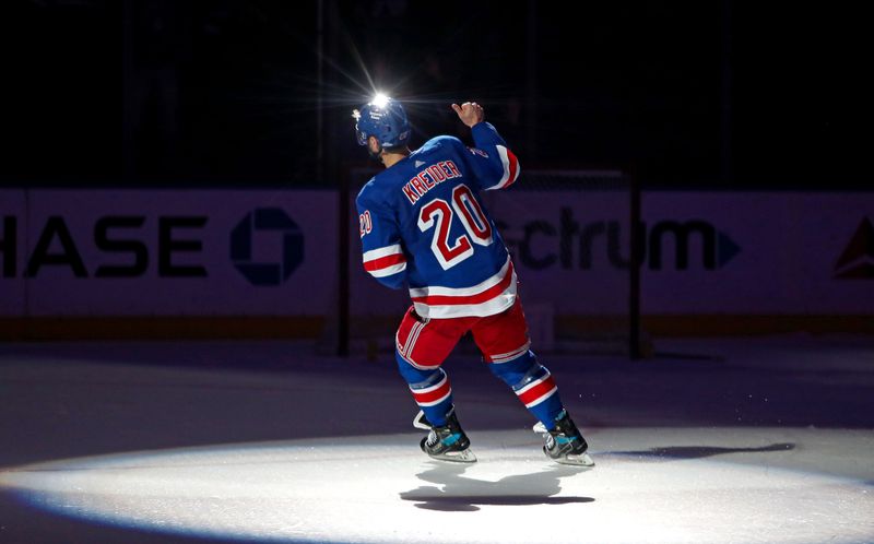 Apr 5, 2023; New York, New York, USA; New York Rangers left wing Chris Kreider (20) is honored as the second star of the game after scoring two goals against the Tampa Bay Lightning at Madison Square Garden. Mandatory Credit: Danny Wild-USA TODAY Sports