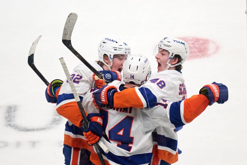 Mar 7, 2026; San Jose, California, USA; New York Islanders center Bo Horvat (14) celebrates with defenseman Matthew Schaefer (48) and right wing Simon Holmstrom (92) after scoring the game-winning goal against the San Jose Sharks during the overtime period at SAP Center at San Jose. Mandatory Credit: Robert Edwards-Imagn Images
