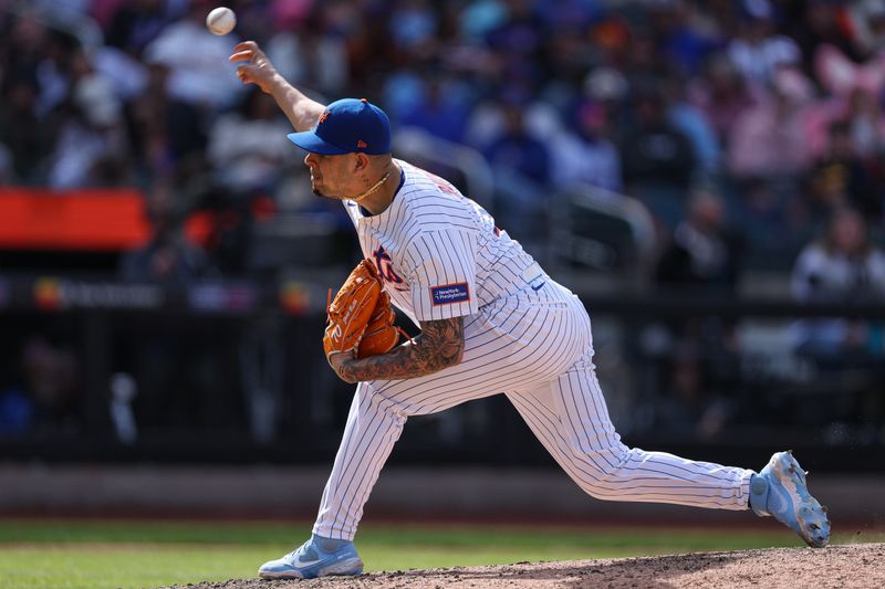 Apr 20, 2025; New York City, New York, USA; New York Mets relief pitcher Jose Butto (70) delivers a pitch during the eighth inning against the St. Louis Cardinals at Citi Field. Mandatory Credit: Vincent Carchietta-Imagn Images