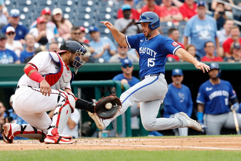 Sep 26, 2024; Washington, District of Columbia, USA; Kansas City Royals shortstop Paul DeJong (15) scores a run ahead of a tag by Washington Nationals catcher Keibert Ruiz (20) during the fourth inning at Nationals Park. Mandatory Credit: Geoff Burke-Imagn Images