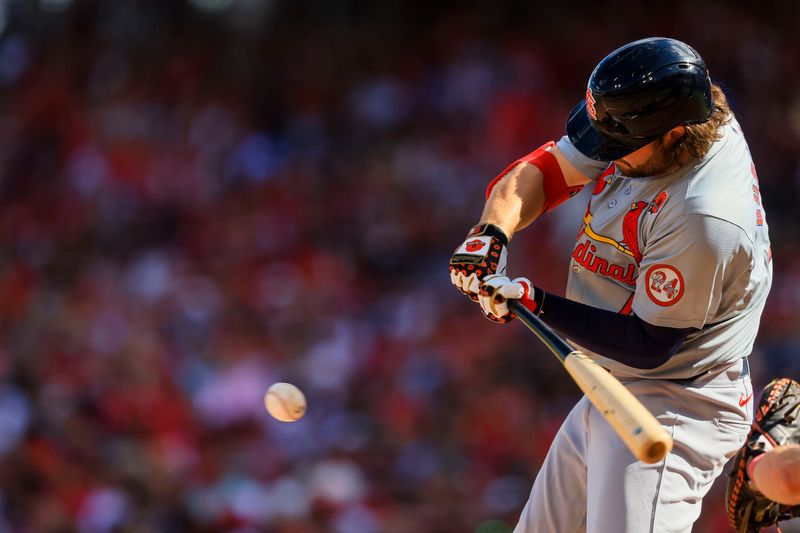 May 27, 2024; Cincinnati, Ohio, USA; St. Louis Cardinals outfielder Alec Burleson (41) hits a single against the Cincinnati Reds in the sixth inning at Great American Ball Park. Mandatory Credit: Katie Stratman-USA TODAY Sports