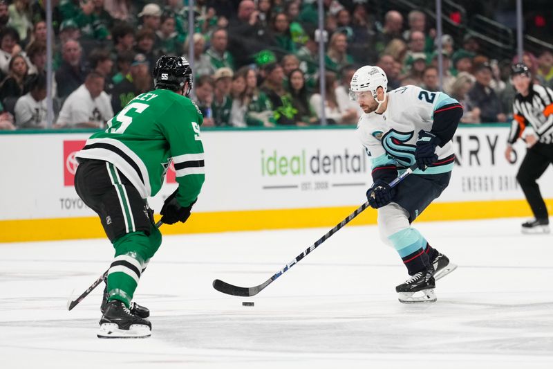 Oct 13, 2024; Dallas, Texas, USA;  Seattle Kraken right wing Oliver Bjorkstrand (22) skates with the puck as Dallas Stars center Matt Duchene (95) defends during the first period at American Airlines Center. Mandatory Credit: Chris Jones-Imagn Images