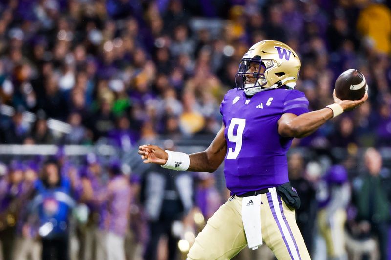 Sep 23, 2023; Seattle, Washington, USA; Washington Huskies quarterback Michael Penix Jr. (9) throws a touchdown pass against the California Golden Bears during the second quarter at Alaska Airlines Field at Husky Stadium. Mandatory Credit: Joe Nicholson-USA TODAY Sports