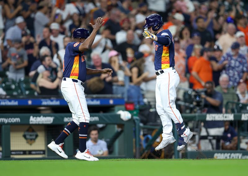 Sep 8, 2024; Houston, Texas, USA; Houston Astros third baseman Alex Bregman (2) celebrates with third base coach Gary Pettis (8) after hitting a home run during the fourth inning against the Arizona Diamondbacks at Minute Maid Park. Mandatory Credit: Troy Taormina-Imagn Images