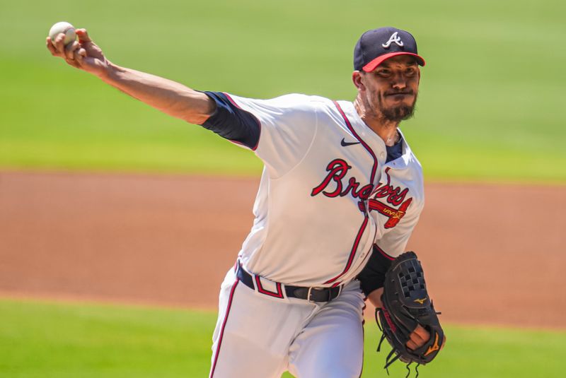 Aug 8, 2024; Cumberland, Georgia, USA; Atlanta Braves starting pitcher Charlie Morton (50) pitches against the Milwaukee Brewers during the first inning at Truist Park. Mandatory Credit: Dale Zanine-USA TODAY Sports
