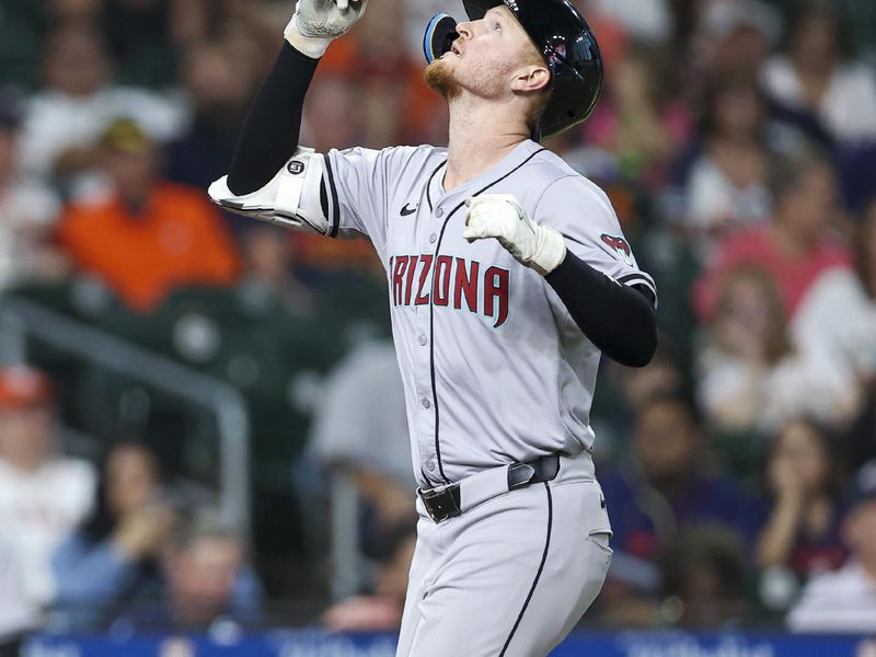 Sep 8, 2024; Houston, Texas, USA; Arizona Diamondbacks left fielder Pavin Smith (26) looks up after hitting a home run during the fifth inning against the Houston Astros at Minute Maid Park. Mandatory Credit: Troy Taormina-Imagn Images