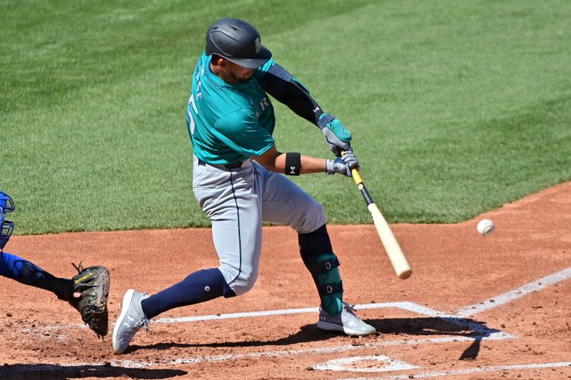 Mar 8, 2024; Mesa, Arizona, USA;  Seattle Mariners center fielder Jonatan Clase (85) hits an RBI double in the second inning against the Chicago Cubs during a spring training game at Sloan Park. Mandatory Credit: Matt Kartozian-USA TODAY Sports