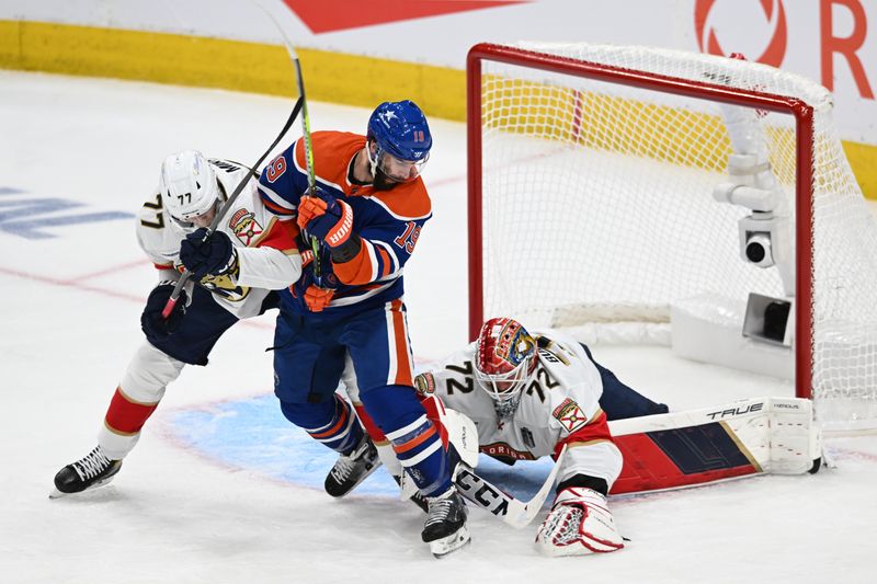 Jun 13, 2024; Edmonton, Alberta, CAN; Florida Panthers goaltender Sergei Bobrovsky (72) makes a save on Edmonton Oilers center Adam Henrique (19) in the second period in game three of the 2024 Stanley Cup Final at Rogers Place. Mandatory Credit: Walter Tychnowicz-USA TODAY Sports