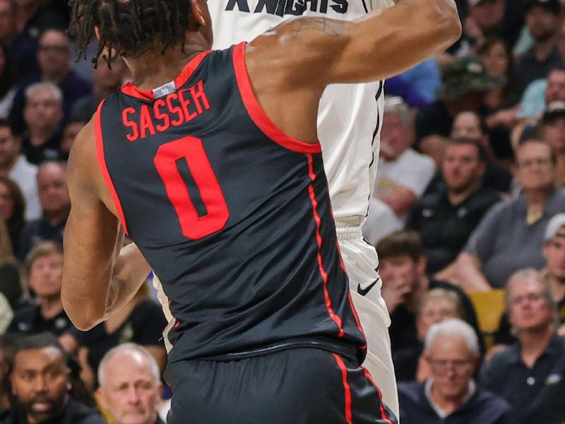 Jan 25, 2023; Orlando, Florida, USA; UCF Knights guard Ithiel Horton (12) shoots the ball over Houston Cougars guard Marcus Sasser (0) during the first half at Addition Financial Arena. Mandatory Credit: Mike Watters-USA TODAY Sports