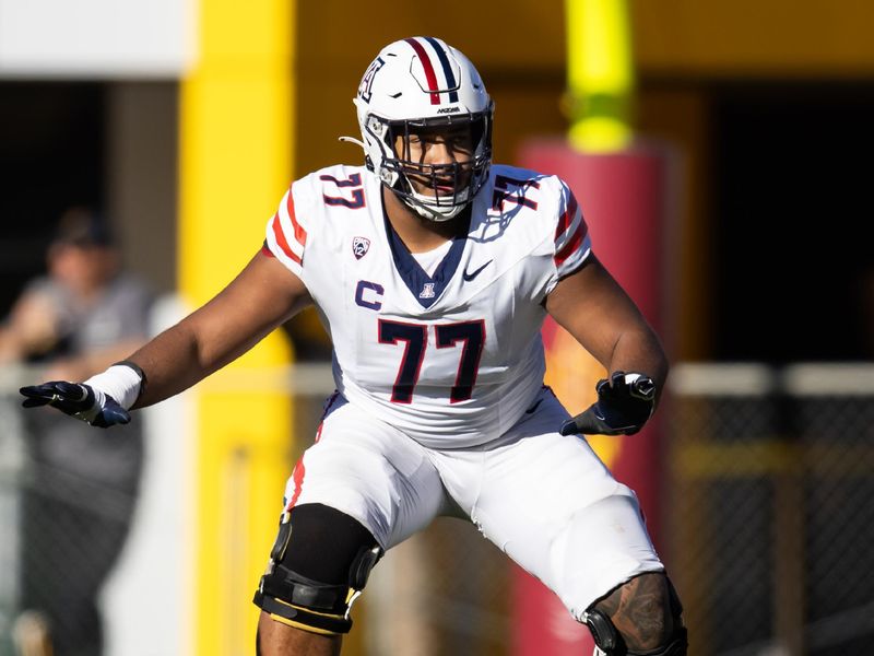 Nov 25, 2023; Tempe, Arizona, USA; Arizona Wildcats offensive lineman Jordan Morgan (77) against the Arizona State Sun Devils during the Territorial Cup at Mountain America Stadium. Mandatory Credit: Mark J. Rebilas-USA TODAY Sports