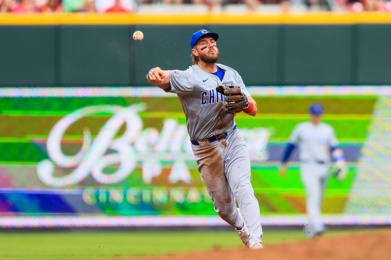 Jun 8, 2024; Cincinnati, Ohio, USA; Chicago Cubs third baseman Patrick Wisdom (16) throws to first in attempt to get Cincinnati Reds second baseman Jonathan India (not pictured) out in the fifth inning at Great American Ball Park. Mandatory Credit: Katie Stratman-USA TODAY Sports