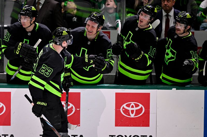 Mar 22, 2025; Dallas, Texas, USA; Dallas Stars left wing Jason Robertson (21) and center Roope Hintz (24) and center Oskar Bäck (10) and center Sam Steel (18) celebrates a goal scored by defenseman Esa Lindell (23) against the Philadelphia Flyers during the first period at the American Airlines Center. Mandatory Credit: Jerome Miron-Imagn Images