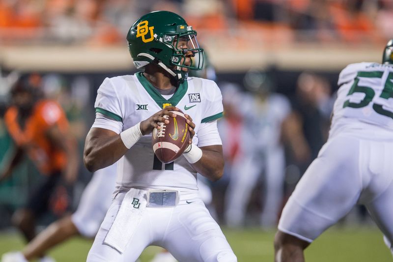 Oct 2, 2021; Stillwater, Oklahoma, USA; Baylor Bears quarterback Gerry Bohanon (11) looks to pass during the second quarter against the Oklahoma State Cowboys at Boone Pickens Stadium. Mandatory Credit: Brett Rojo-USA TODAY Sports