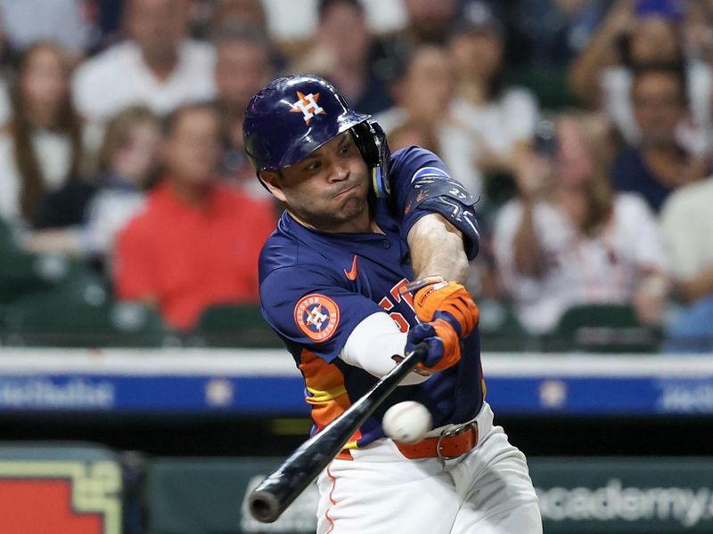 Sep 21, 2025; Houston, Texas, USA; Houston Astros second baseman Jose Altuve (27) hits an RBI single against the Seattle Mariners in the seventh inning at Daikin Park. Mandatory Credit: Thomas Shea-Imagn Images