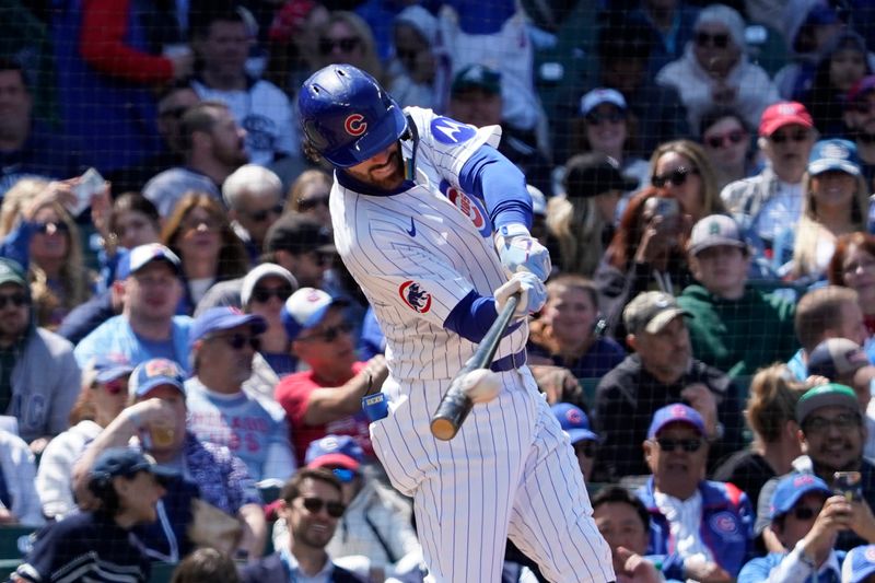 May 18, 2025; Chicago, Illinois, USA; Chicago Cubs shortstop Dansby Swanson (7) gets a hit against the Chicago White Sox during the fifth inning at Wrigley Field. Mandatory Credit: David Banks-Imagn Images