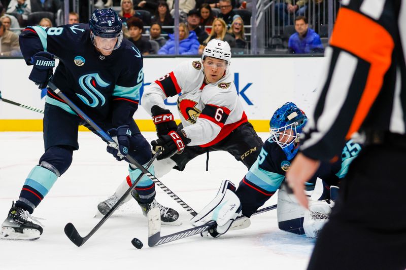 Jan 4, 2024; Seattle, Washington, USA; Seattle Kraken goaltender Joey Daccord (35) pokes the puck away from defenseman Brian Dumoulin (8) and Ottawa Senators defenseman Jakob Chychrun (6) during the third period at Climate Pledge Arena. Mandatory Credit: Joe Nicholson-USA TODAY Sports