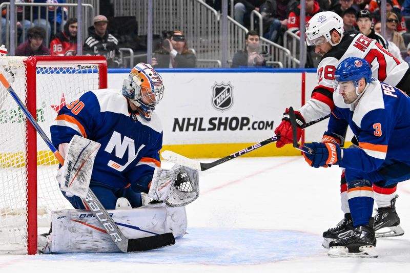 Mar 24, 2024; Elmont, New York, USA;  New York Islanders goaltender Ilya Sorokin (30) makes a save against the New Jersey Devils during the first period at UBS Arena. Mandatory Credit: Dennis Schneidler-USA TODAY Sports