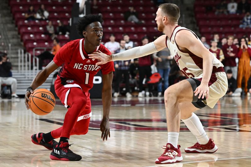 Feb 11, 2023; Chestnut Hill, Massachusetts, USA; Boston College Eagles guard Mason Madsen (45) defends North Carolina State Wolfpack guard Jarkel Joiner (1) during the first half at the Conte Forum. Mandatory Credit: Brian Fluharty-USA TODAY Sports