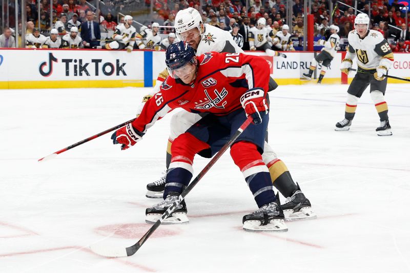 Oct 15, 2024; Washington, District of Columbia, USA; Washington Capitals center Nic Dowd (26) skates with the puck as Vegas Golden Knights center Tomas Hertl (48) defends in the third period at Capital One Arena. Mandatory Credit: Geoff Burke-Imagn Images