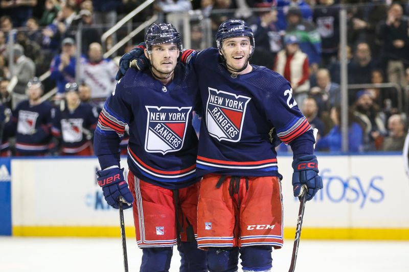 Feb 7, 2024; New York, New York, USA; New York Rangers center Jonny Brodzinski (22) celebrates with defenseman Ryan Lindgren (55) after scoring a goal in the second period against the Tampa Bay Lightning at Madison Square Garden. Mandatory Credit: Wendell Cruz-USA TODAY Sports