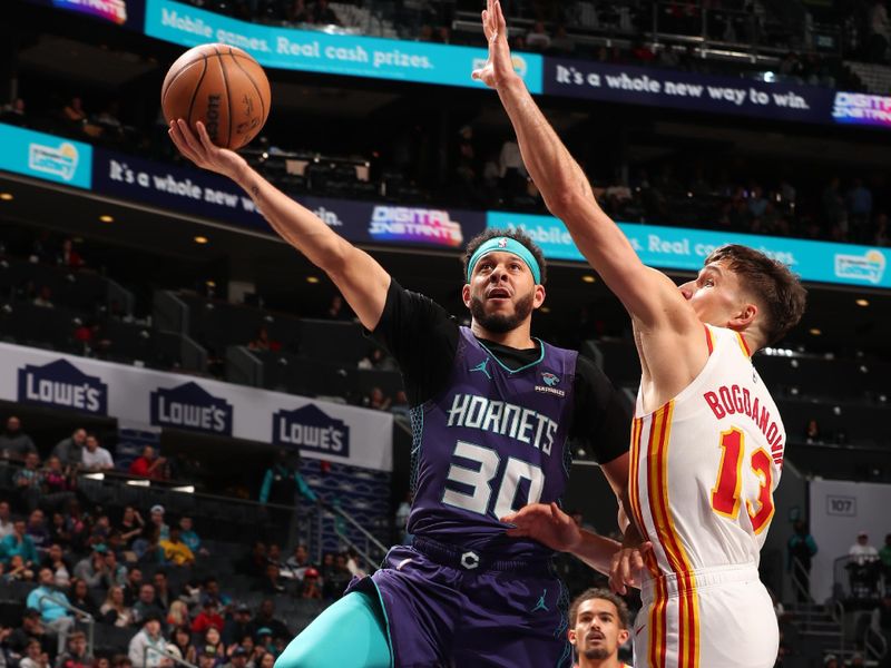 CHARLOTTE, NC - FEBRUARY 14: Seth Curry #30 of the Charlotte Hornets drives to the basket during the game against the Atlanta Hawks on February 14, 2024 at Spectrum Center in Charlotte, North Carolina. NOTE TO USER: User expressly acknowledges and agrees that, by downloading and or using this photograph, User is consenting to the terms and conditions of the Getty Images License Agreement. Mandatory Copyright Notice: Copyright 2024 NBAE (Photo by Kent Smith/NBAE via Getty Images)