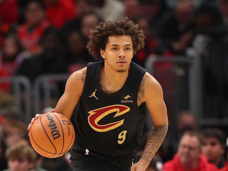 CHICAGO, ILLINOIS - DECEMBER 23: Craig Porter #9 of the Cleveland Cavaliers dribbles up the court against the Chicago Bulls during the first half at the United Center on December 23, 2023 in Chicago, Illinois. NOTE TO USER: User expressly acknowledges and agrees that, by downloading and or using this photograph, User is consenting to the terms and conditions of the Getty Images License Agreement.  (Photo by Michael Reaves/Getty Images)