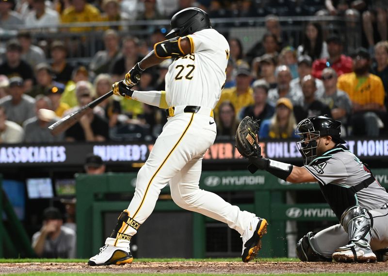 Aug 3, 2024; Pittsburgh, Pennsylvania, USA;  Pittsburgh Pirates batter Andrew McCutchen (22) hits a single against the Arizona Diamondbacks in the sixth inning at PNC Park. Mandatory Credit: Philip G. Pavely-USA TODAY Sports