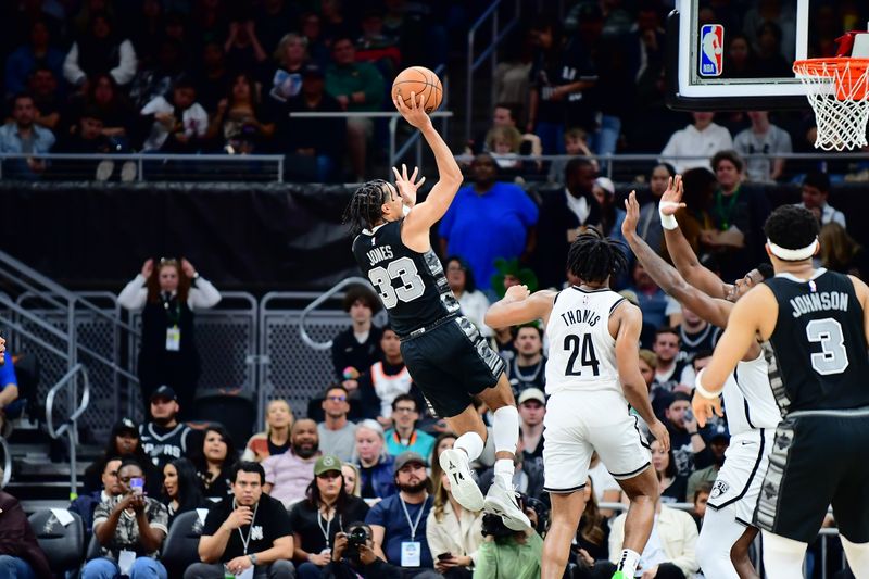 AUSTIN, TX - MARCH 17: Tre Jones #33 of the San Antonio Spurs shoots the ball during the game against the Brooklyn Nets on March 17, 2024 at the Moody Center in Austin, Texas. NOTE TO USER: User expressly acknowledges and agrees that, by downloading and or using this photograph, user is consenting to the terms and conditions of the Getty Images License Agreement. Mandatory Copyright Notice: Copyright 2024 NBAE (Photos by Michael Gonzales/NBAE via Getty Images)