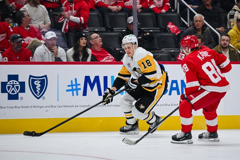 Oct 10, 2024; Detroit, Michigan, USA; Pittsburgh Penguins right wing Jesse Puljujarvi (18) brings the puck up ice against Detroit Red Wings right wing Patrick Kane (88) during the third period at Little Caesars Arena. Mandatory Credit: Tim Fuller-Imagn Images