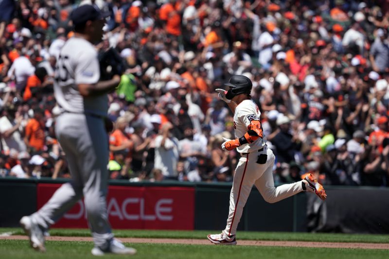 Jun 2, 2024; San Francisco, California, USA; San Francisco Giants shortstop Casey Schmitt (10) gestures while rounding the bases after hitting a home run against New York Yankees starting pitcher Nestor Cortes (left) during the fourth inning at Oracle Park. Mandatory Credit: Darren Yamashita-USA TODAY Sports