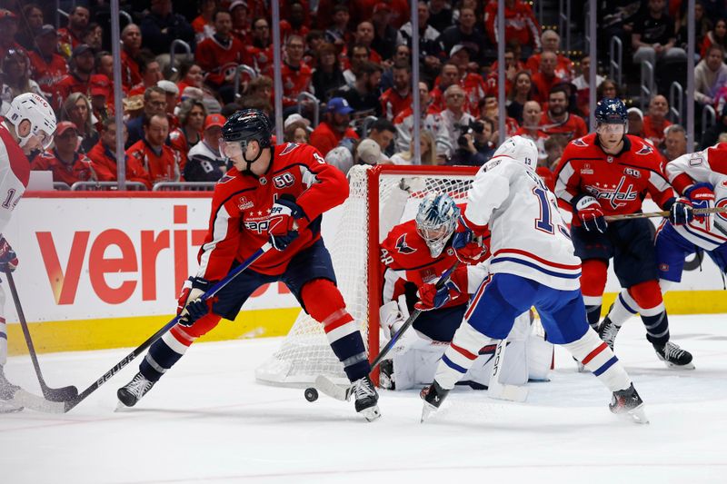 Apr 21, 2025; Washington, District of Columbia, USA; Washington Capitals goaltender Logan Thompson (48) makes a save on Montreal Canadiens right wing Cole Caufield (13) in the second period in game one of the first round of the 2025 Stanley Cup Playoffs at Capital One Arena. Mandatory Credit: Geoff Burke-Imagn Images