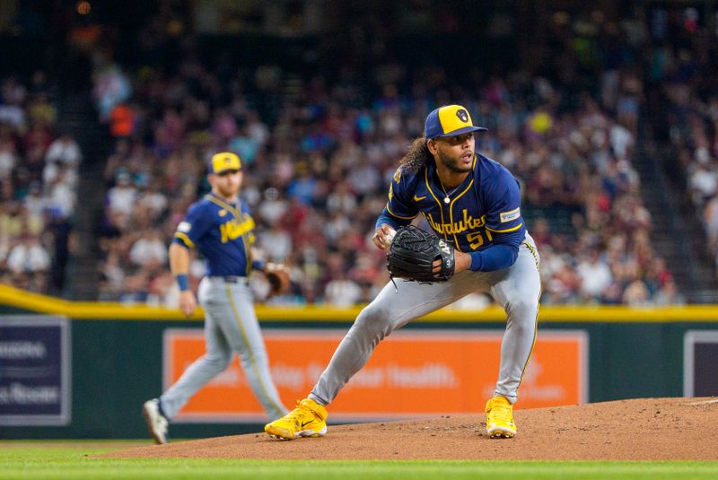 Apr 13, 2025; Phoenix, Arizona, USA;  Milwaukee Brewers pitcher Freddy Peralta (51) fields a ball hit back to the mound in the second inning by the Arizona Diamondbacks at Chase Field. Mandatory Credit: Allan Henry-Imagn Images