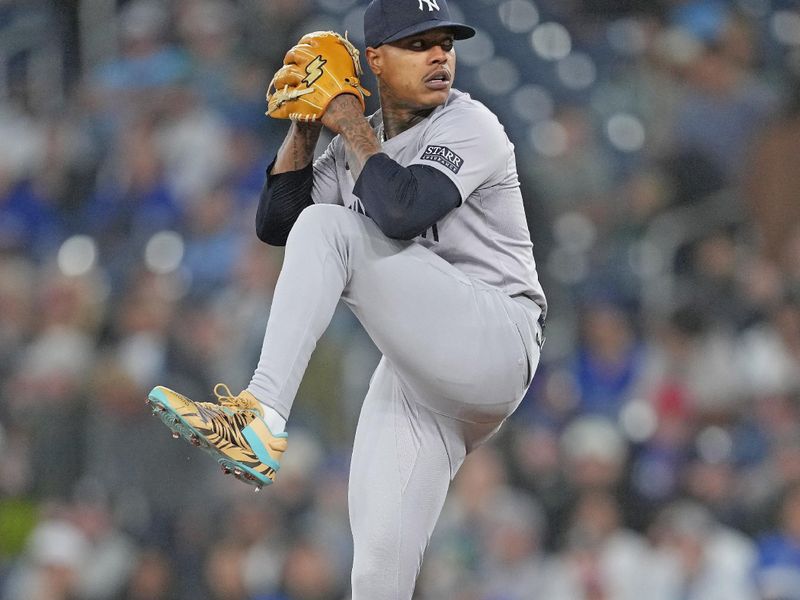 Apr 17, 2024; Toronto, Ontario, CAN; New York Yankees starting pitcher Marcus Stroman (0) throws a pitch against the Toronto Blue Jays during the first inning at Rogers Centre. Mandatory Credit: Nick Turchiaro-USA TODAY Sports