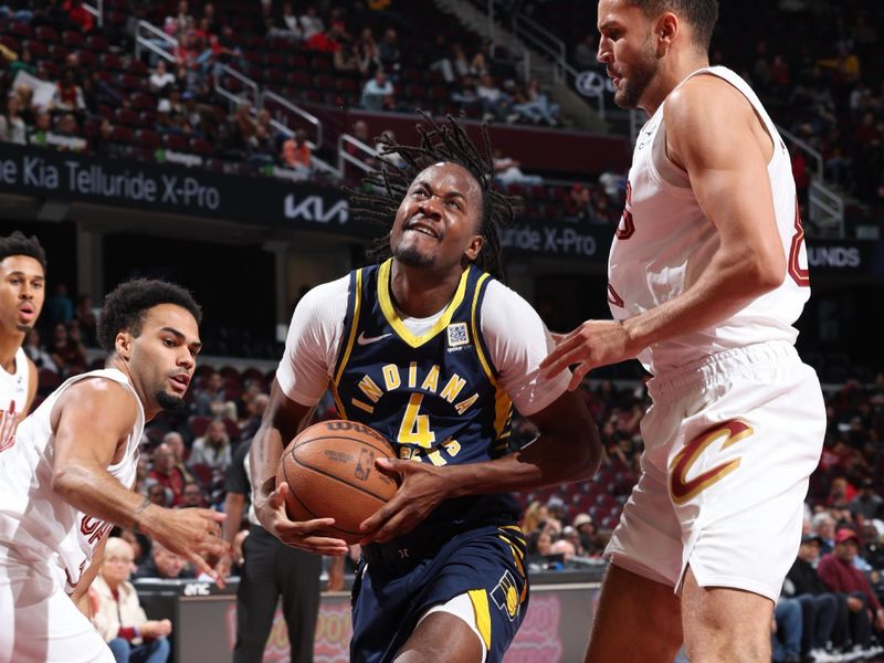 Cleveland, OH - OCTOBER 10: Tristen Newton #4 of the Indiana Pacers drives to the basket during the game against the Cleveland Cavaliers during a NBA pre season game on October 10, 2024 at Rocket Mortgage Fieldhouse in Cleveland, Ohio. NOTE TO USER: User expressly acknowledges and agrees that, by downloading and or using this photograph, User is consenting to the terms and conditions of the Getty Images License Agreement. Mandatory Copyright Notice: Copyright 2024 NBAE (Photo by Jeff Haynes/NBAE via Getty Images)