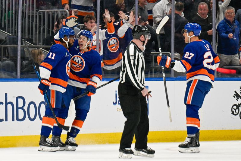 Jan 6, 2026; Elmont, New York, USA;  New York Islanders center Mathew Barzal (13) celebrates the goal by New York Islanders left wing Anthony Duclair (11) against the New Jersey Devils during the first period at UBS Arena. Mandatory Credit: Dennis Schneidler-Imagn Images