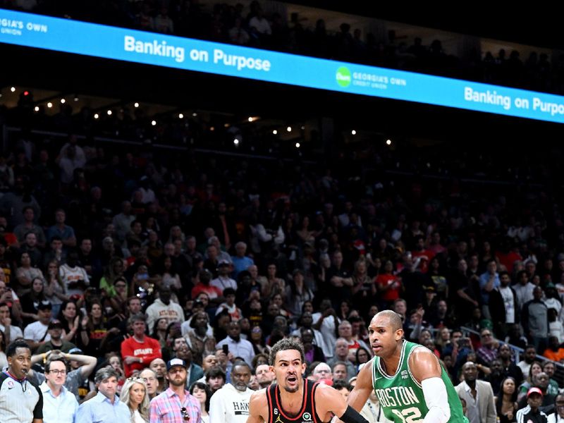 ATLANTA, GA - APRIL 21: Trae Young #11 of the Atlanta Hawks drives to the basket against the Boston Celtics during round one game three of the 2023 NBA Playoffs on April 21, 2023 at State Farm Arena in Atlanta, Georgia.  NOTE TO USER: User expressly acknowledges and agrees that, by downloading and/or using this Photograph, user is consenting to the terms and conditions of the Getty Images License Agreement. Mandatory Copyright Notice: Copyright 2023 NBAE (Photo by Adam Hagy/NBAE via Getty Images)