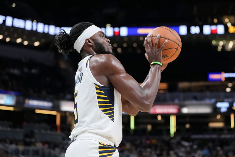 INDIANAPOLIS, INDIANA - OCTOBER 14: Jarace Walker #5 of the Indiana Pacers handles the ball in the second quarter against the Memphis Grizzlies during a preseason game at Gainbridge Fieldhouse on October 14, 2024 in Indianapolis, Indiana. NOTE TO USER: User expressly acknowledges and agrees that, by downloading and or using this photograph, User is consenting to the terms and conditions of the Getty Images License Agreement. (Photo by Dylan Buell/Getty Images)