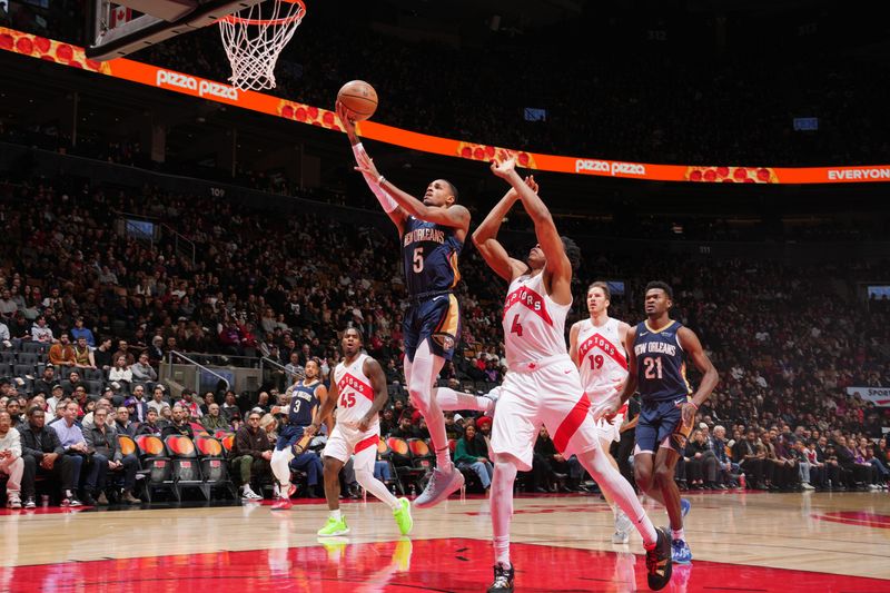 TORONTO, CANADA - JANUARY 27:  Dejounte Murray #5 of the New Orleans Pelicans drives to the basket during the game against the Toronto Raptors on January 27, 2025 at the Scotiabank Arena in Toronto, Ontario, Canada.  NOTE TO USER: User expressly acknowledges and agrees that, by downloading and or using this Photograph, user is consenting to the terms and conditions of the Getty Images License Agreement.  Mandatory Copyright Notice: Copyright 2025 NBAE (Photo by Mark Blinch/NBAE via Getty Images)