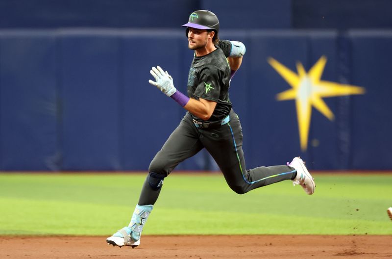 Aug 17, 2024; St. Petersburg, Florida, USA;  Tampa Bay Rays outfielder Josh Lowe (15) runs to third base as he triples against the Arizona Diamondbacks during the first inning at Tropicana Field. Mandatory Credit: Kim Klement Neitzel-USA TODAY Sports