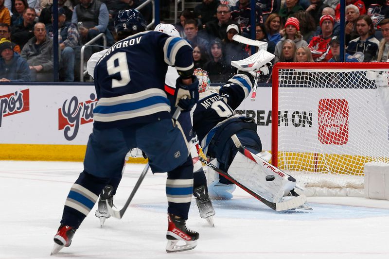 Dec 21, 2023; Columbus, Ohio, USA; Columbus Blue Jackets goalie Elvis Merzlikins (90) makes a pad save against the Washington Capitals during the second period at Nationwide Arena. Mandatory Credit: Russell LaBounty-USA TODAY Sports